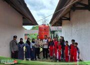 Polsek Kuala Behe Serahkan Bantuan Sumur Bor Di SMPN 01 Kuala Behe
